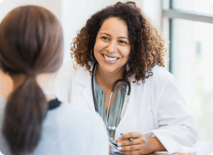 A clinician with a patient